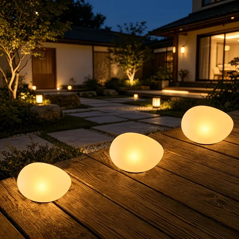 1pcs Solar simulated pebble garden light, frosted texture blends naturally, smart light control auto on/off, waterproof and weather-resistant, stable placement, ideal for garden, lawn, pathway, and landscape lighting.*Warm light