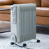 Portable electric heater in a living room setting with a couch and coffee table.