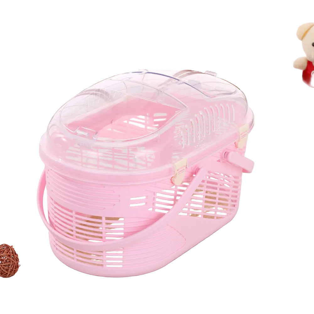 Pink pet carrier with transparent lid on a light wooden floor.