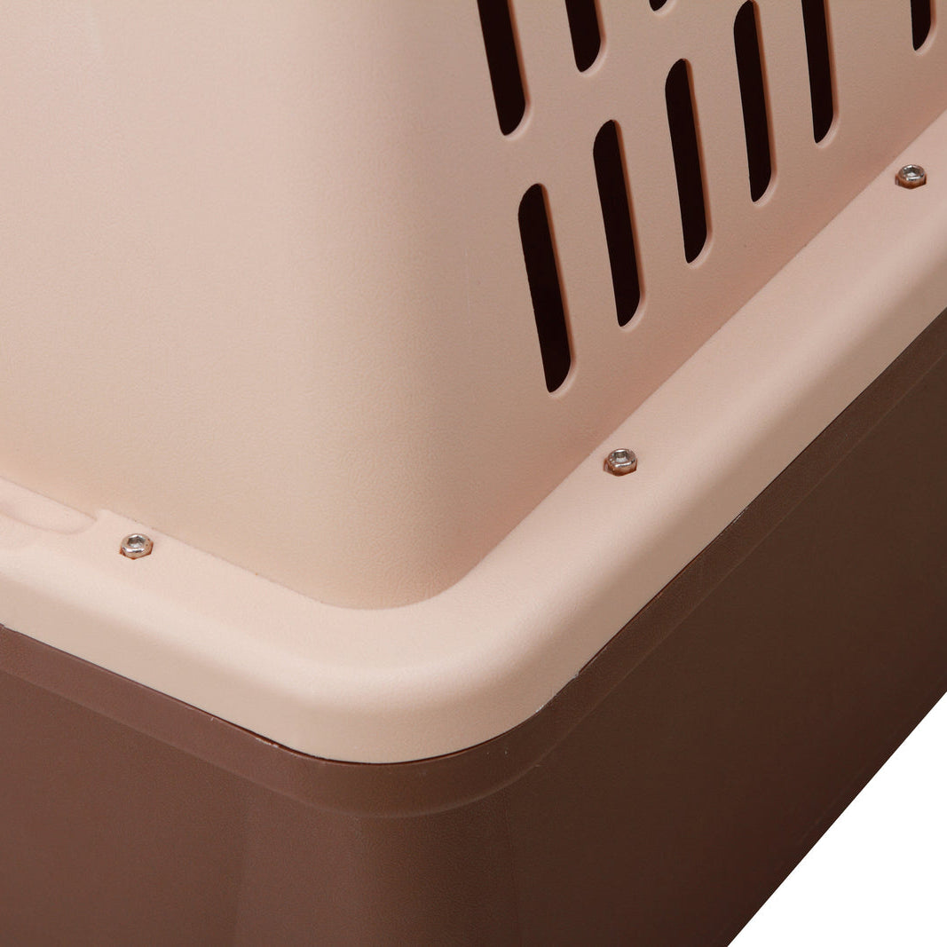 Close-up of a pet carrier with a brown base and beige top.