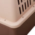 Close-up of a pet carrier with a brown base and beige top.