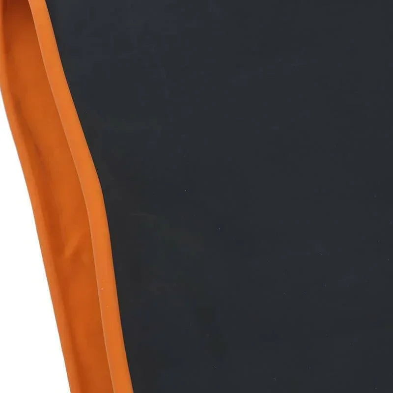 Close-up of black fabric with orange trim, likely part of a sun protection glove.