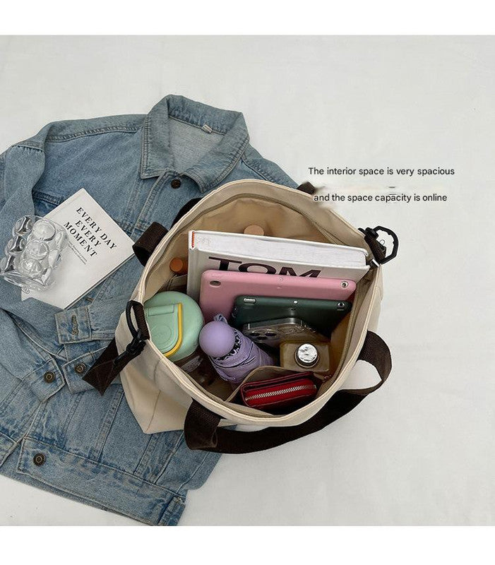 Stylish white canvas tote bag with detachable shoulder strap