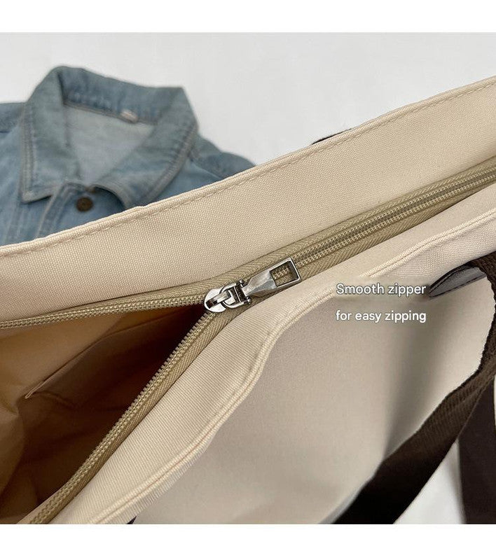 Stylish khaki canvas tote bag with detachable shoulder strap