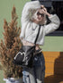 Stylish black tote backpack with heart embellishment - can be worn on one shoulder or as a backpack