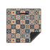 A square mat featuring a colorful vintage-style mosaic tile pattern, shown on a plain white background with one corner folded over to reveal a dark textured underside.