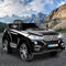 black ride-on toy car for kids with LED headlights, parked outdoors on mountain road