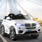 White kids electric ride-on car SUV with LED headlights on a modern bridge